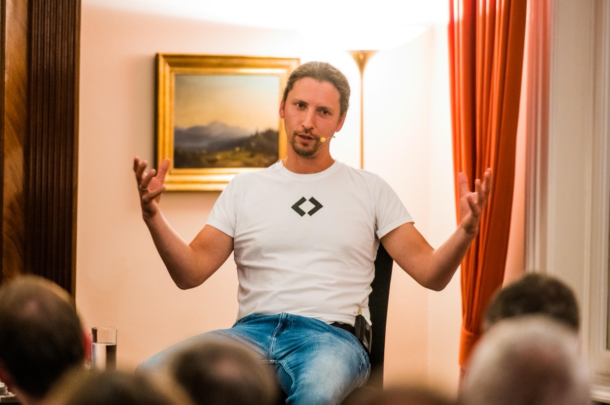 Manuel Dolderer speaking in an intimate setting